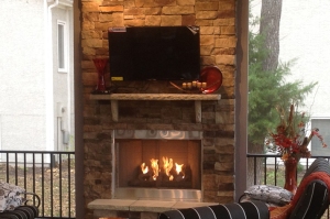 KC screened porch with outdoor fireplace